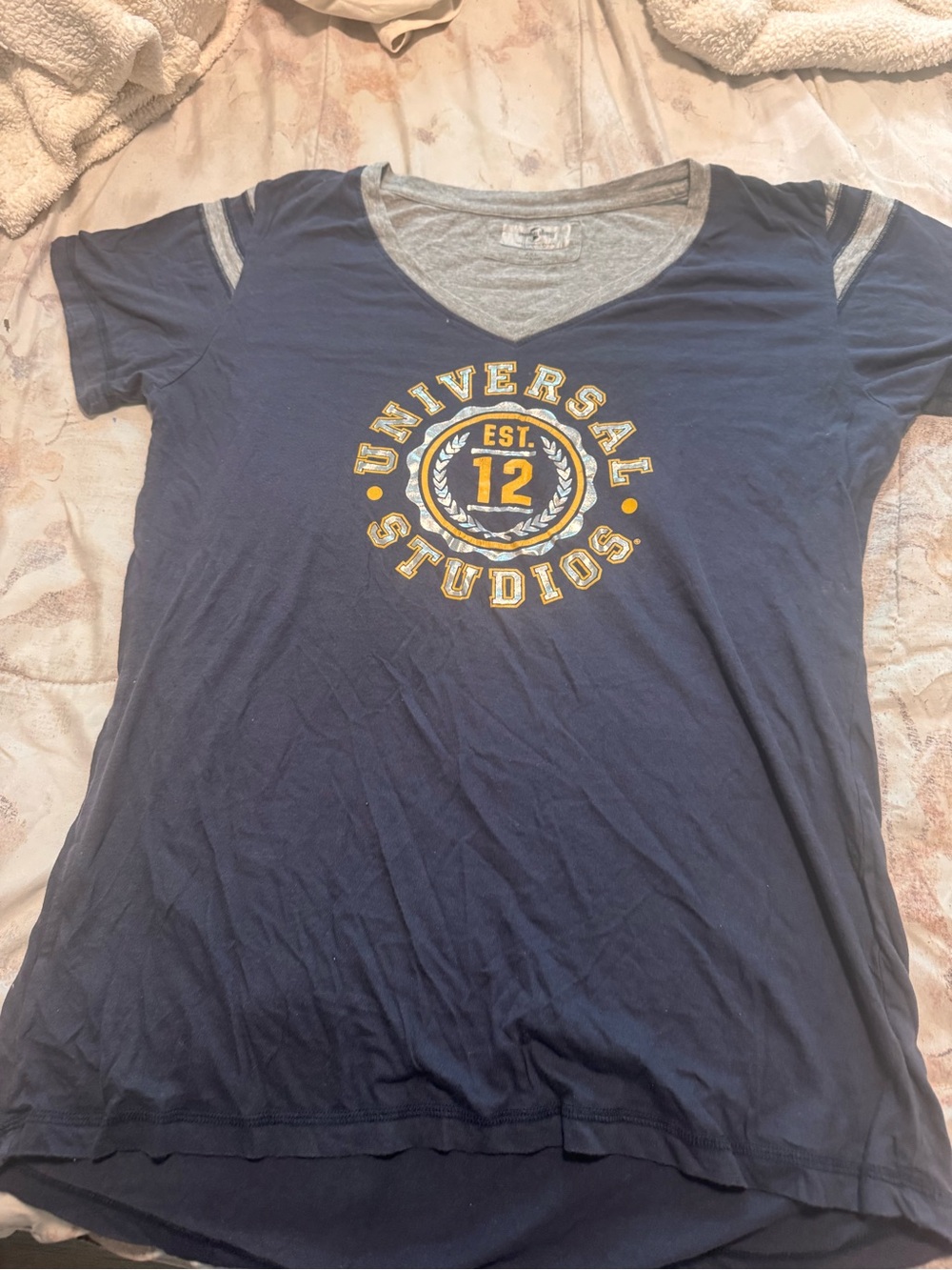 Universal Navy V-Neck Short Sleeve Tee with Gold Graphic